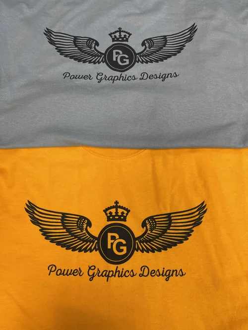 Two-tone shirt with a winged crest logo decorated by Power Graphics