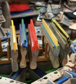 Printing screens and tools lined up in the Power Graphics production area